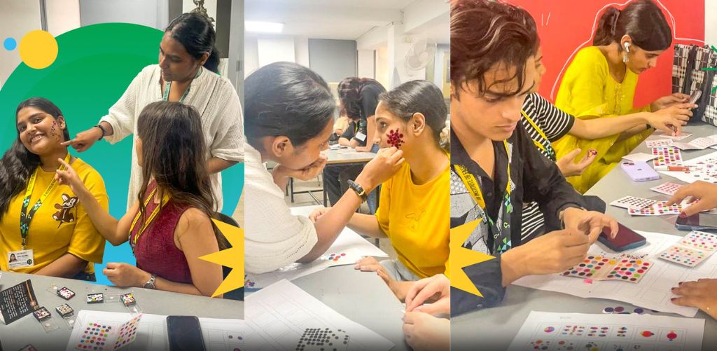 Faculty at JD Institute guiding students in understanding colour theory, proportion, and cultural symbolism using bindis, an Indian traditional accessory, as part of a unique and innovative design learning approach.